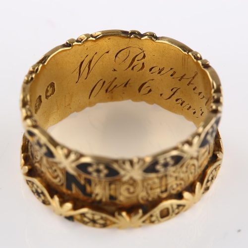 1130 - A Victorian 18ct gold and black enamel 'in memory of' memorial band ring, with allover foliate engra... 