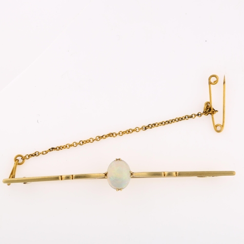 1132 - A 15ct gold opal bar brooch, set with oval cabochon opal, opal measures: 8.28 x 6.80 x 4.75mm, brooc... 