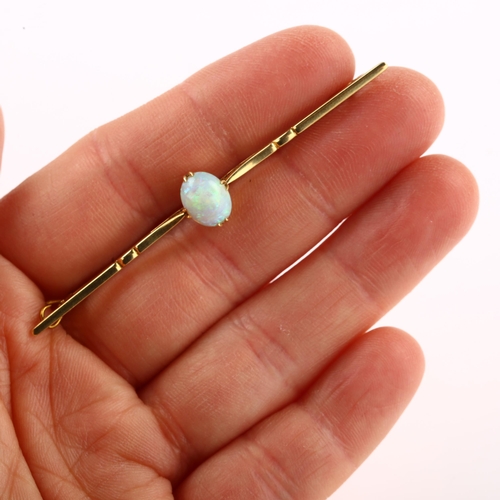 1132 - A 15ct gold opal bar brooch, set with oval cabochon opal, opal measures: 8.28 x 6.80 x 4.75mm, brooc... 