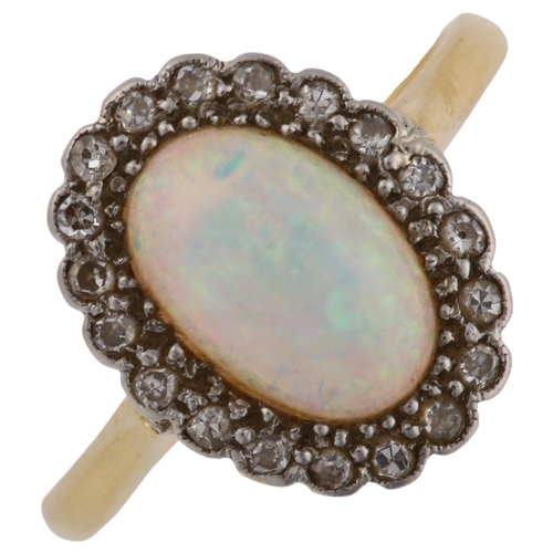 1133 - An 18ct gold opal and diamond cluster ring, platinum-topped set with oval cabochon opal and single-c... 