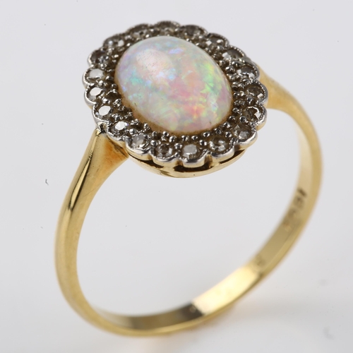 1133 - An 18ct gold opal and diamond cluster ring, platinum-topped set with oval cabochon opal and single-c... 