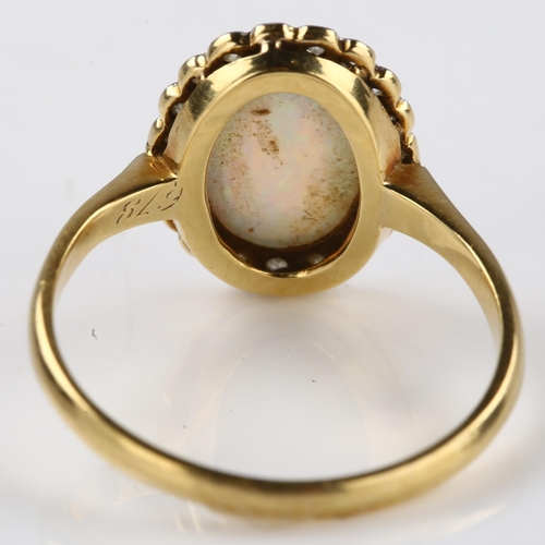 1133 - An 18ct gold opal and diamond cluster ring, platinum-topped set with oval cabochon opal and single-c... 