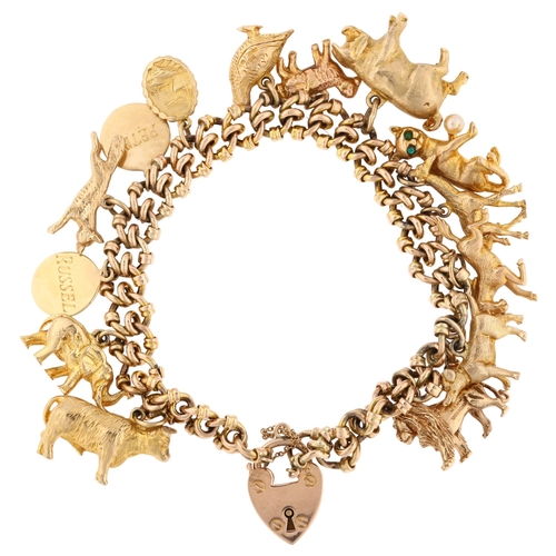 1135 - A mid-20th century 9ct rose gold fancy curb link charm bracelet, with 14 x 9ct charms, mostly animal... 