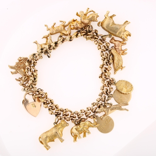 1135 - A mid-20th century 9ct rose gold fancy curb link charm bracelet, with 14 x 9ct charms, mostly animal... 