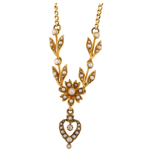 1137 - A Victorian split pearl and diamond drop pendant necklace, with flowerhead and openwork heart motif,... 