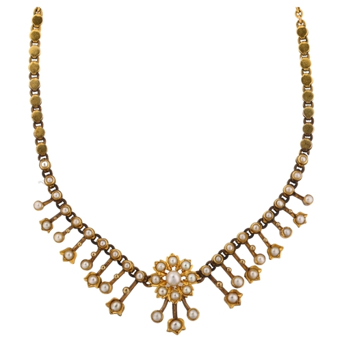 1138 - A Victorian split pearl graduated fringe necklace, with flowerhead and tulip motif, unmarked gold se... 