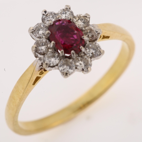 1140 - An 18ct gold ruby and diamond cluster ring, set with oval mixed-cut ruby and modern round brilliant-... 