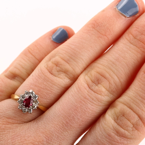 1140 - An 18ct gold ruby and diamond cluster ring, set with oval mixed-cut ruby and modern round brilliant-... 