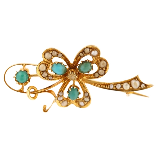 1142 - An Edwardian turquoise and pearl shamrock openwork brooch, stamped 18, brooch length 35.1mm, 3.4g