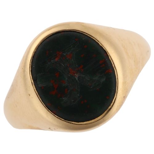 1144 - An early 20th century 18ct gold bloodstone 'Double Headed Eagle', seal signet ring, set with oval in... 