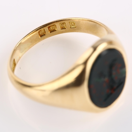 1144 - An early 20th century 18ct gold bloodstone 'Double Headed Eagle', seal signet ring, set with oval in... 