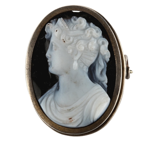 1405 - An Antique hardstone cameo brooch, unmarked white metal frame with relief carved panel depicting fem... 