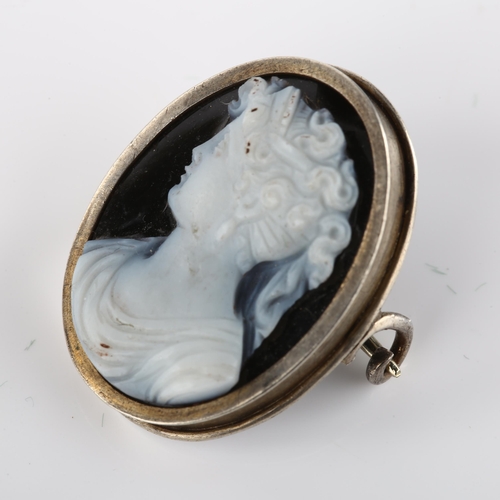 1405 - An Antique hardstone cameo brooch, unmarked white metal frame with relief carved panel depicting fem... 