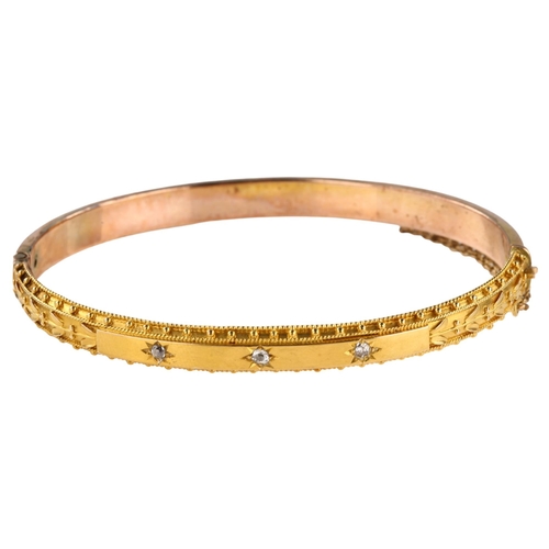 1177 - A Victorian Etruscan style diamond hinged bangle, star set with old-cut diamonds in unmarked gold se... 