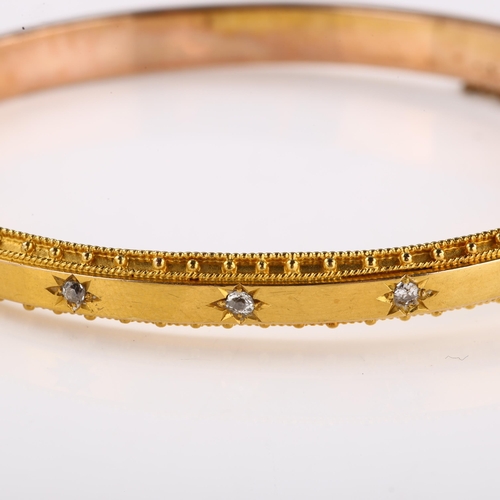 1177 - A Victorian Etruscan style diamond hinged bangle, star set with old-cut diamonds in unmarked gold se... 