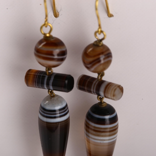 1182 - A pair of Victorian banded agate drop earrings with 9ct gold shepherd hook fittings, earring height ... 