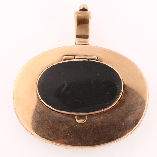 1183 - A Georgian black melanite garnet and hairwork locket pendant, unmarked rose gold settings with main ... 