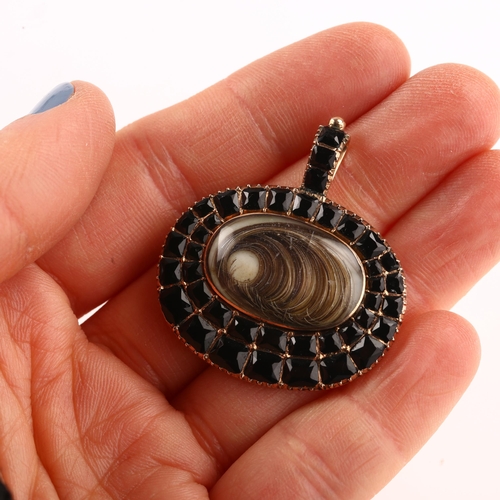 1183 - A Georgian black melanite garnet and hairwork locket pendant, unmarked rose gold settings with main ... 