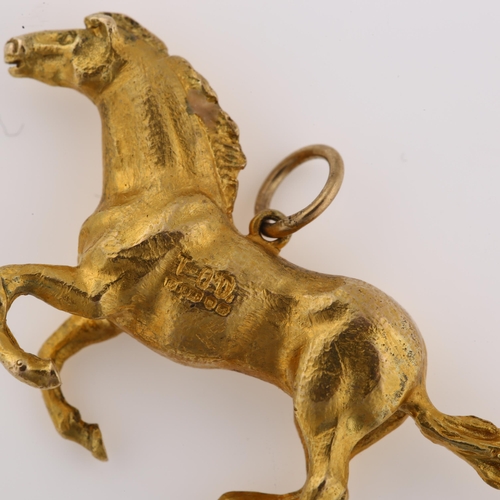 1190 - A late 20th century 9ct gold galloping horse pendant, realistically modelled, maker's marks TO'D, ha... 