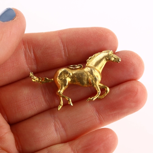 1190 - A late 20th century 9ct gold galloping horse pendant, realistically modelled, maker's marks TO'D, ha... 