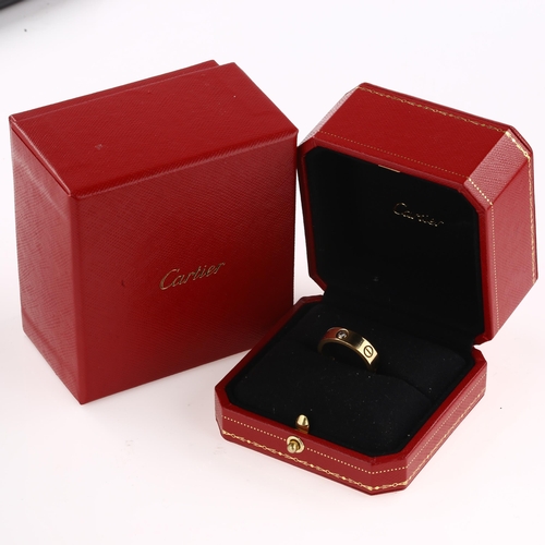 1196 - CARTIER - an 18ct gold diamond 'LOVE' band ring, with screw-head motif and modern round brilliant-cu... 