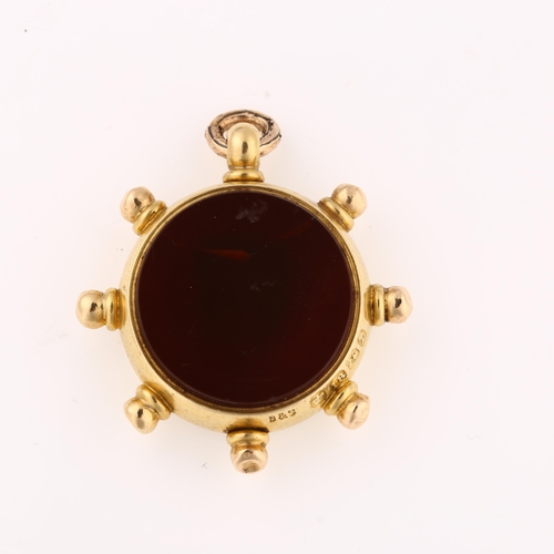 1197 - A late Victorian 18ct gold carnelian ship's wheel compass fob, maker's marks B and S, hallmarks Birm... 