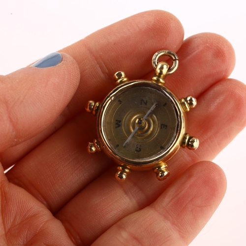 1197 - A late Victorian 18ct gold carnelian ship's wheel compass fob, maker's marks B and S, hallmarks Birm... 