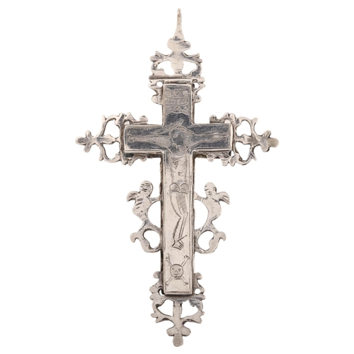 1203 - A 17th century reliquary silver cross pendant, engraved with Crucifixion of Christ beneath letter IN... 