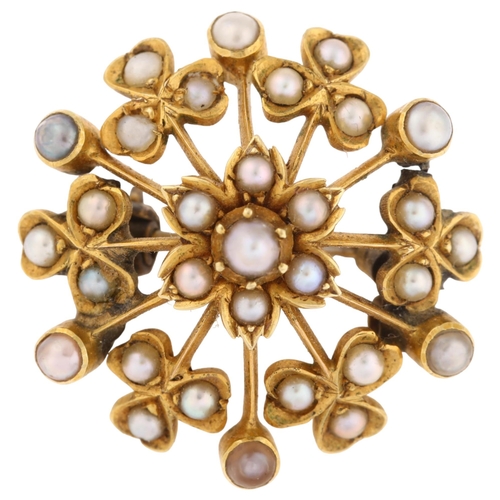 1213 - A Victorian split pearl floral starburst brooch, with flowerhead and shamrock motif, unmarked gold s... 