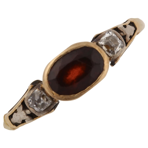 1220 - An Antique three stone garnet and diamond ring, unmarked gold settings with oval mixed-cut garnet an... 