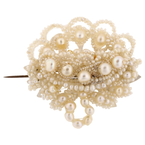 1225 - A Victorian seed pearl and mother-of-pearl openwork brooch, brooch length 39.6mm, 6.8g