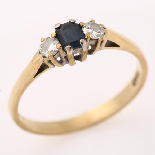 1218 - A modern 9ct gold three stone sapphire and diamond ring, set with emerald-cut sapphire and modern ro... 