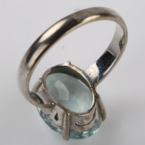 1219 - A 14ct white gold aquamarine dress ring, set with oval mixed-cut aqua, measures: 14.31 x 10.22 x 5.6... 