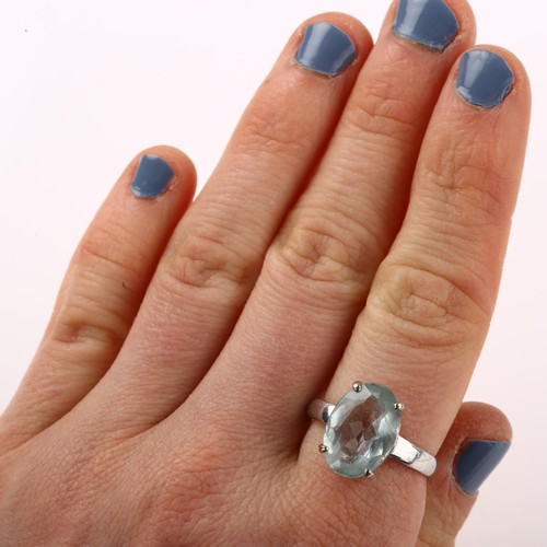 1219 - A 14ct white gold aquamarine dress ring, set with oval mixed-cut aqua, measures: 14.31 x 10.22 x 5.6... 