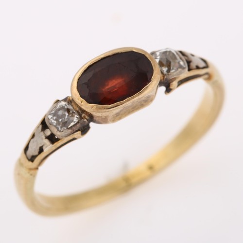 1220 - An Antique three stone garnet and diamond ring, unmarked gold settings with oval mixed-cut garnet an... 