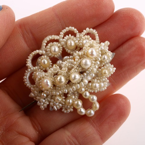 1225 - A Victorian seed pearl and mother-of-pearl openwork brooch, brooch length 39.6mm, 6.8g