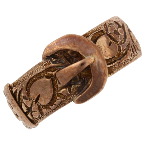 1231 - An early 20th century 9ct rose gold belt buckle band ring, with chased flowerhead and heart motif, m... 