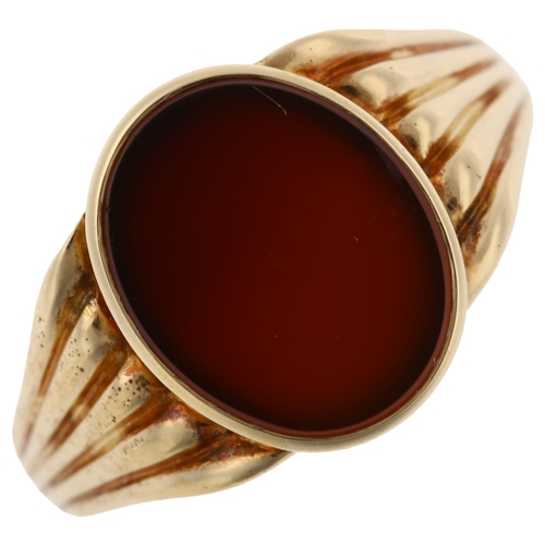 1236 - A large 14ct gold carnelian signet ring, with ribbed shoulders, setting height 14.4mm, size U, 9.8g