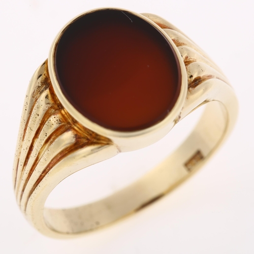 1236 - A large 14ct gold carnelian signet ring, with ribbed shoulders, setting height 14.4mm, size U, 9.8g