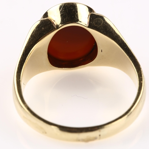 1236 - A large 14ct gold carnelian signet ring, with ribbed shoulders, setting height 14.4mm, size U, 9.8g