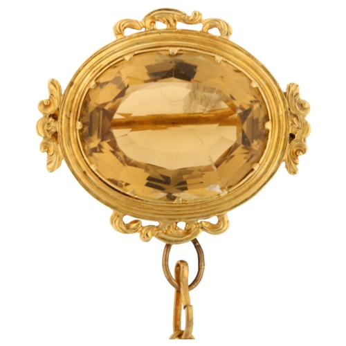 1239 - A Victorian citrine brooch, unmarked gold foliate frame set with oval mixed-cut citrine, brooch leng... 