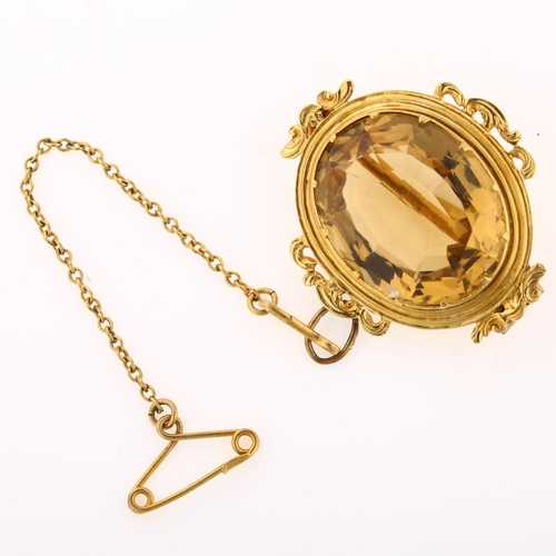 1239 - A Victorian citrine brooch, unmarked gold foliate frame set with oval mixed-cut citrine, brooch leng... 