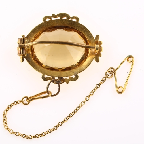 1239 - A Victorian citrine brooch, unmarked gold foliate frame set with oval mixed-cut citrine, brooch leng... 