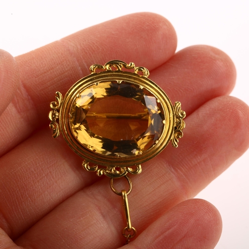 1239 - A Victorian citrine brooch, unmarked gold foliate frame set with oval mixed-cut citrine, brooch leng... 