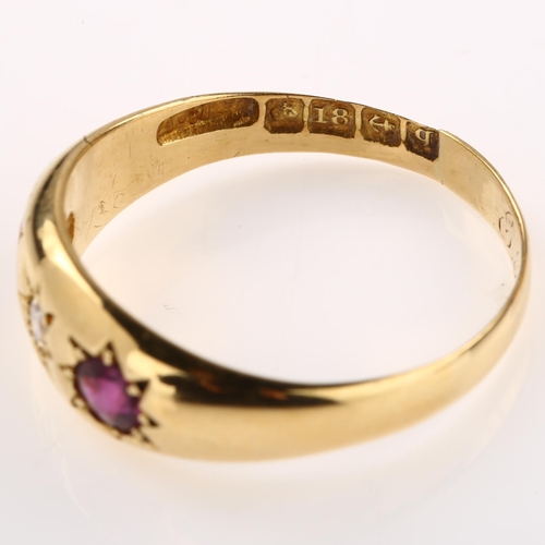 1241 - An early 20th century 18ct gold three stone ruby and diamond gypsy ring, set with round-cut ruby and... 