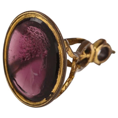 1251 - After Edward Burch (1730 - 1814), a Georgian amethyst paste intaglio seal fob, impressed with male h... 