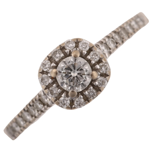 1255 - An 18ct white gold diamond cluster ring, set with modern round brilliant-cut diamonds and diamond se... 