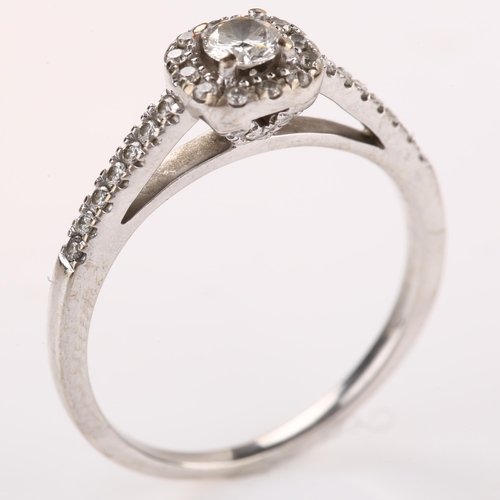 1255 - An 18ct white gold diamond cluster ring, set with modern round brilliant-cut diamonds and diamond se... 