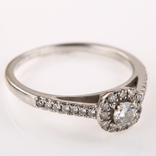 1255 - An 18ct white gold diamond cluster ring, set with modern round brilliant-cut diamonds and diamond se... 