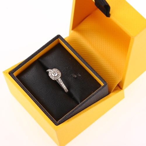 1255 - An 18ct white gold diamond cluster ring, set with modern round brilliant-cut diamonds and diamond se... 